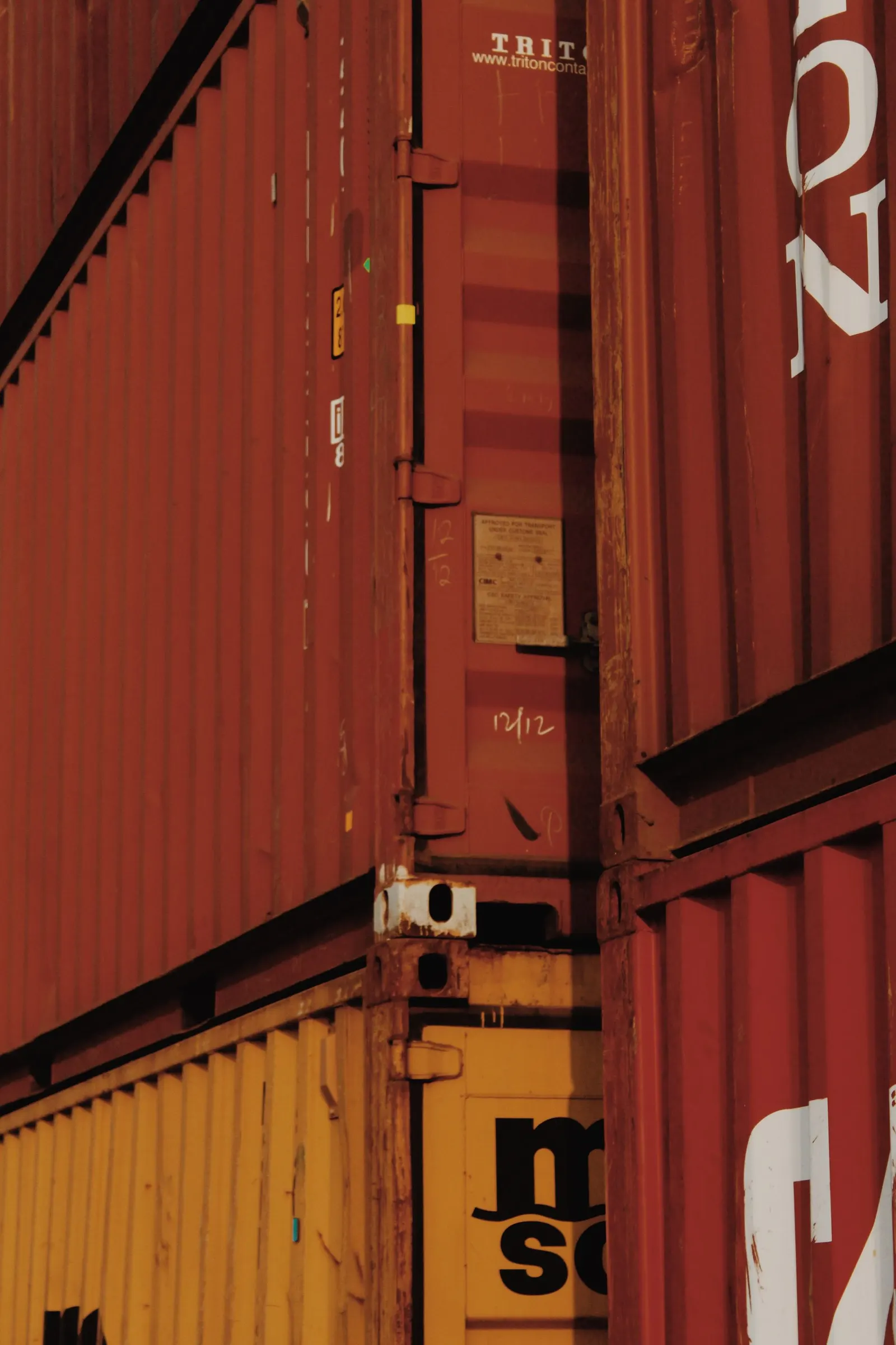 Close-up of a used shipping container's doors, locking bars and weatherproof rubber seals