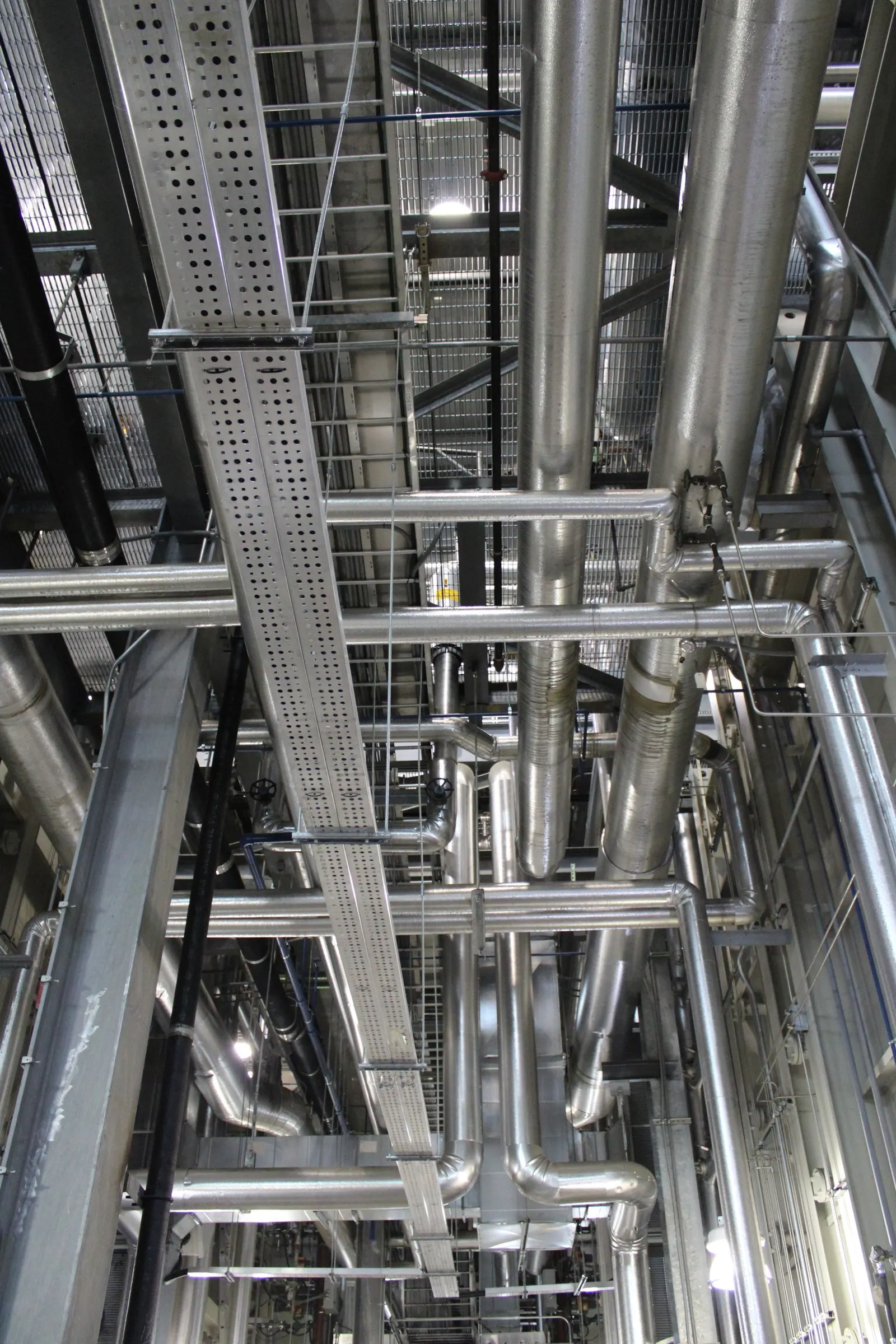Steel pipes and structural steelwork in an industrial building
